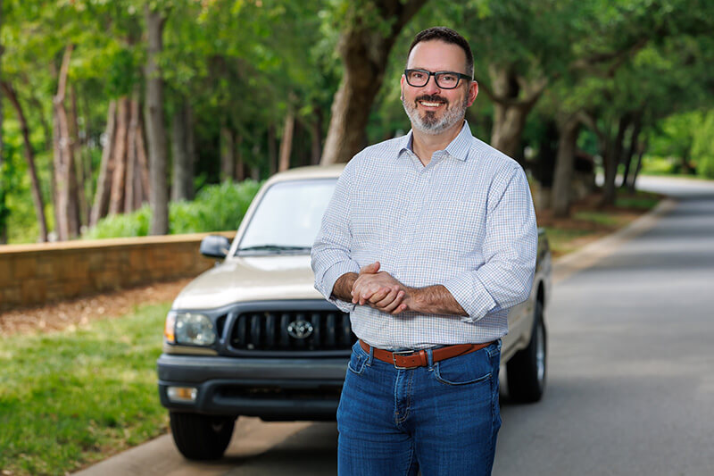 Jeff Hamm standing in front of his favorite truck